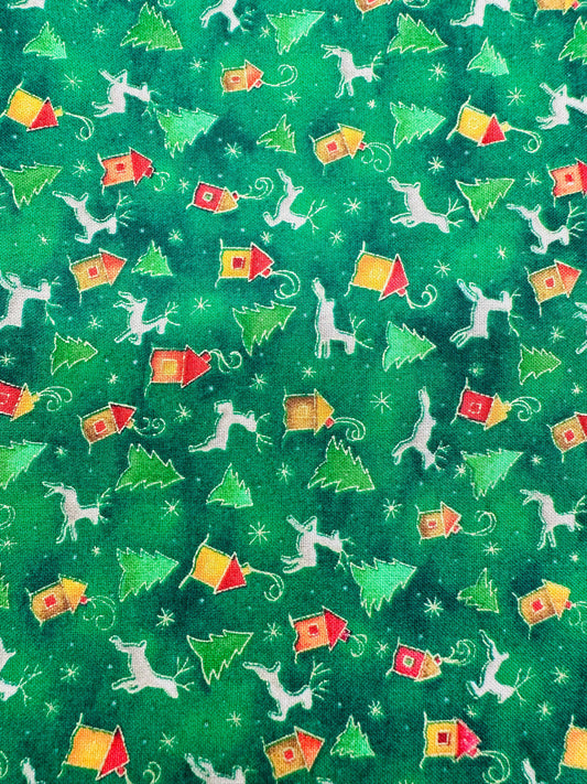 The Reindeer Ruffle Holiday Outfit by Square Up Fashions features green fabric with white cats, Christmas trees, colorful houses, and snowflakes—a playful skirt perfect for festive celebrations.