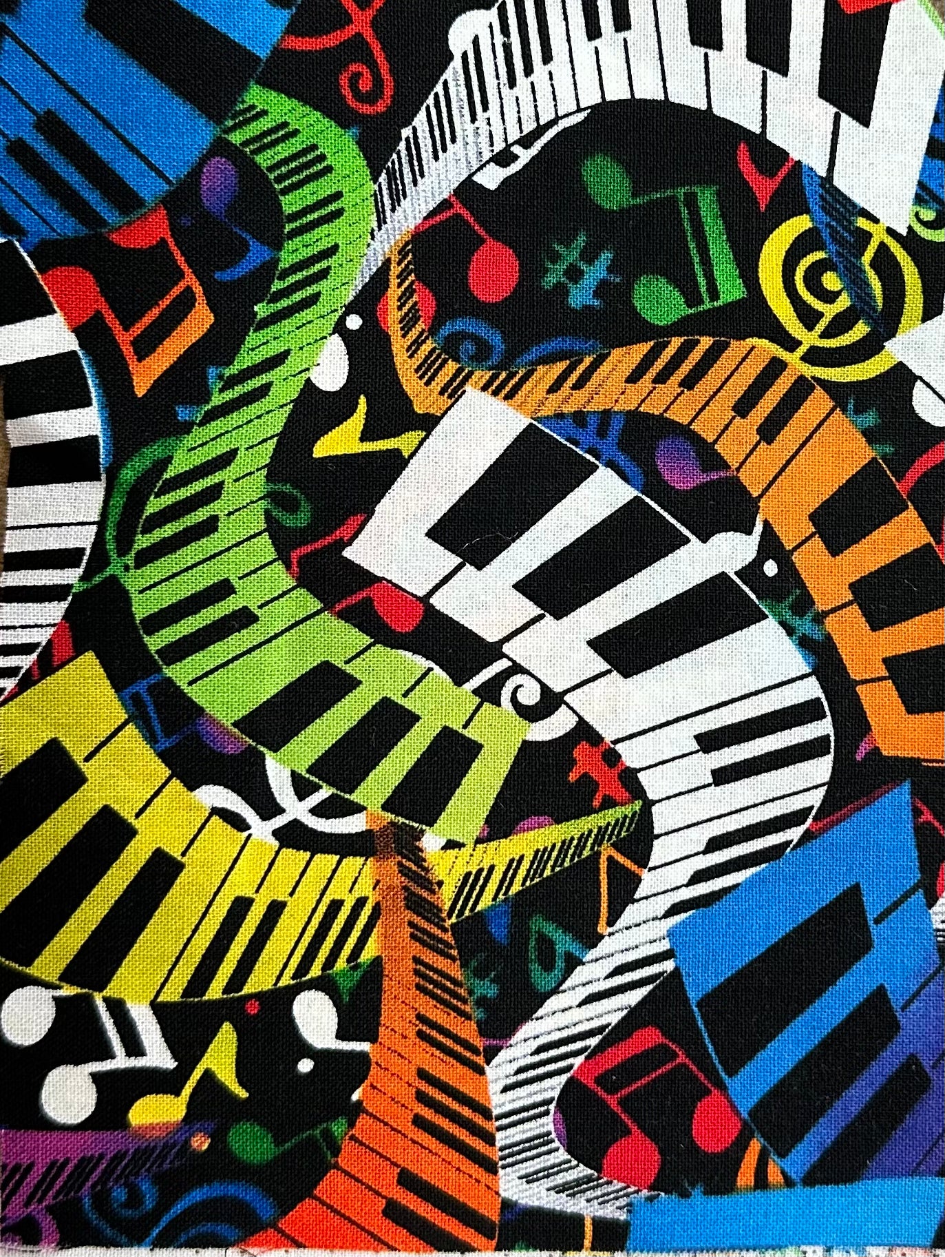 The Musical Multi-color Square Dance Outfit by Square Up Fashions features intertwining piano key stripes and vibrant music notes over black—a bold, exclusive print for standout style.