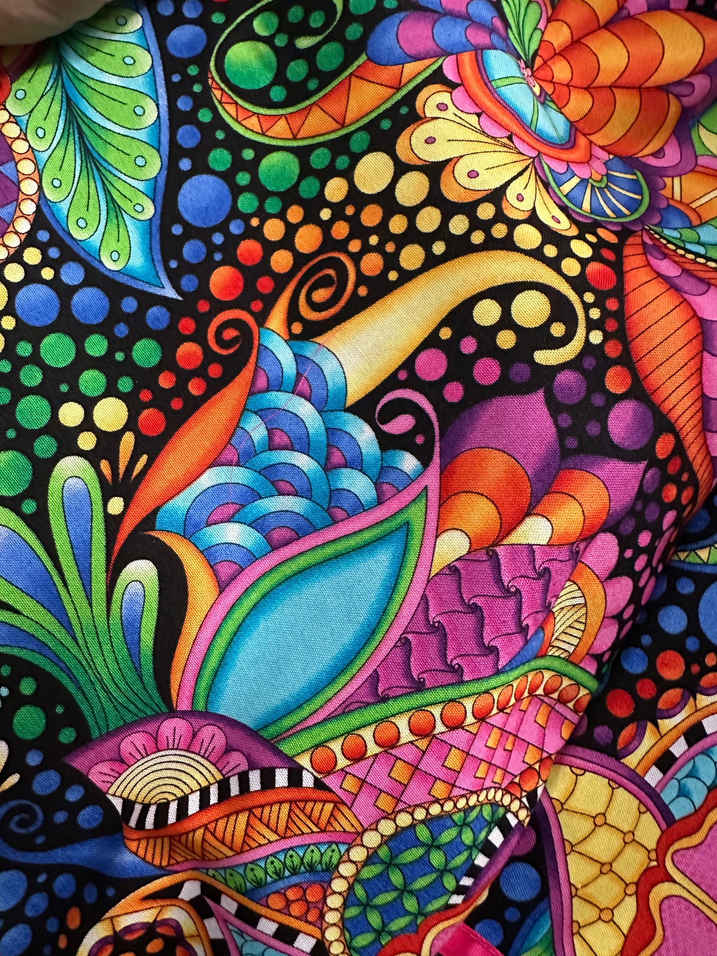 The Vivid Fantasia Square Dance Outfit by Square Up Fashions features a colorful abstract pattern with swirling shapes, leaves, and dots on black—ideal for a lively square dance skirt or vibrant 3/4 sleeve blouse.