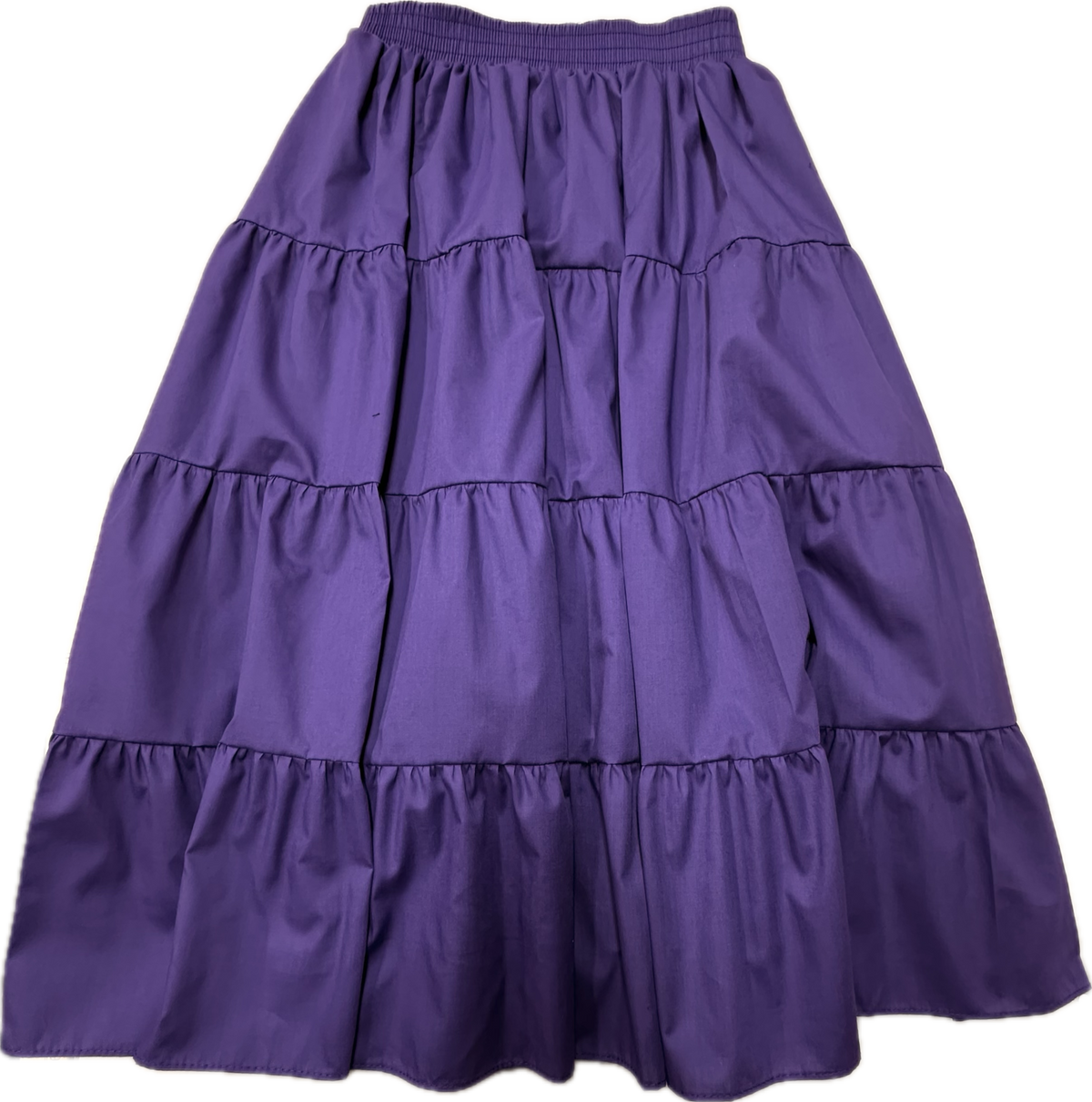The Basic 4 Tier Prairie Skirt by Square Up Fashions is a purple, ankle-length A-line skirt with four tiers, an elastic waistband, and gathered ruffle details. Custom sizes available.