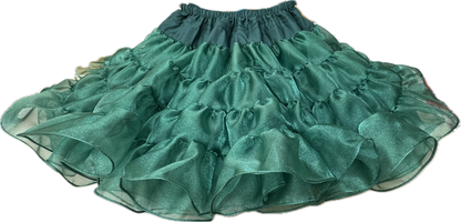 A teal flamenco skirt with ruffles and sparkle on a black background from Square Up Fashions featuring the Crystal Petticoat.