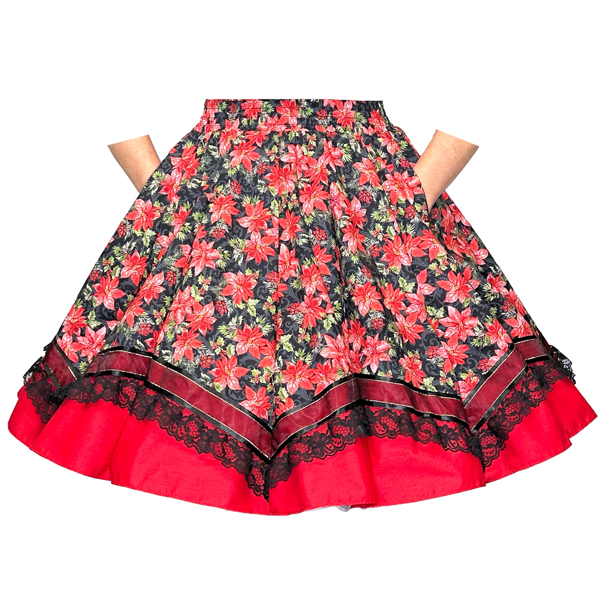 The Square Up Fashions Holiday Poinsettia Square Dance Skirt features a festive floral print with red flowers, black lace trim, a red hem, and handy side pockets.