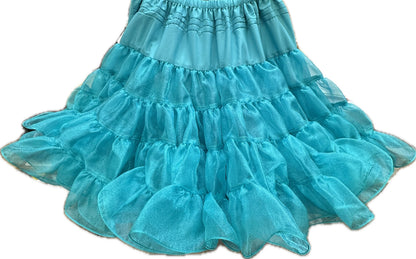 The Square Up Fashions Crystal Petticoat is a turquoise, multi-layered ruffle skirt with an elastic waistband, crafted from shiny sheer fabric and featuring a crystal fabric petticoat for extra volume.