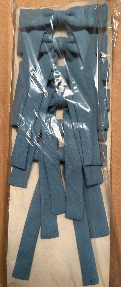 A pack of Colonel Ties from Square Up Fashions, resembling the classic southern bow tie, is neatly arranged inside clear plastic packaging.