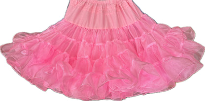 A pink ruffled Crystal Petticoat with layered tulle fabric and an elastic waistband by Square Up Fashions.