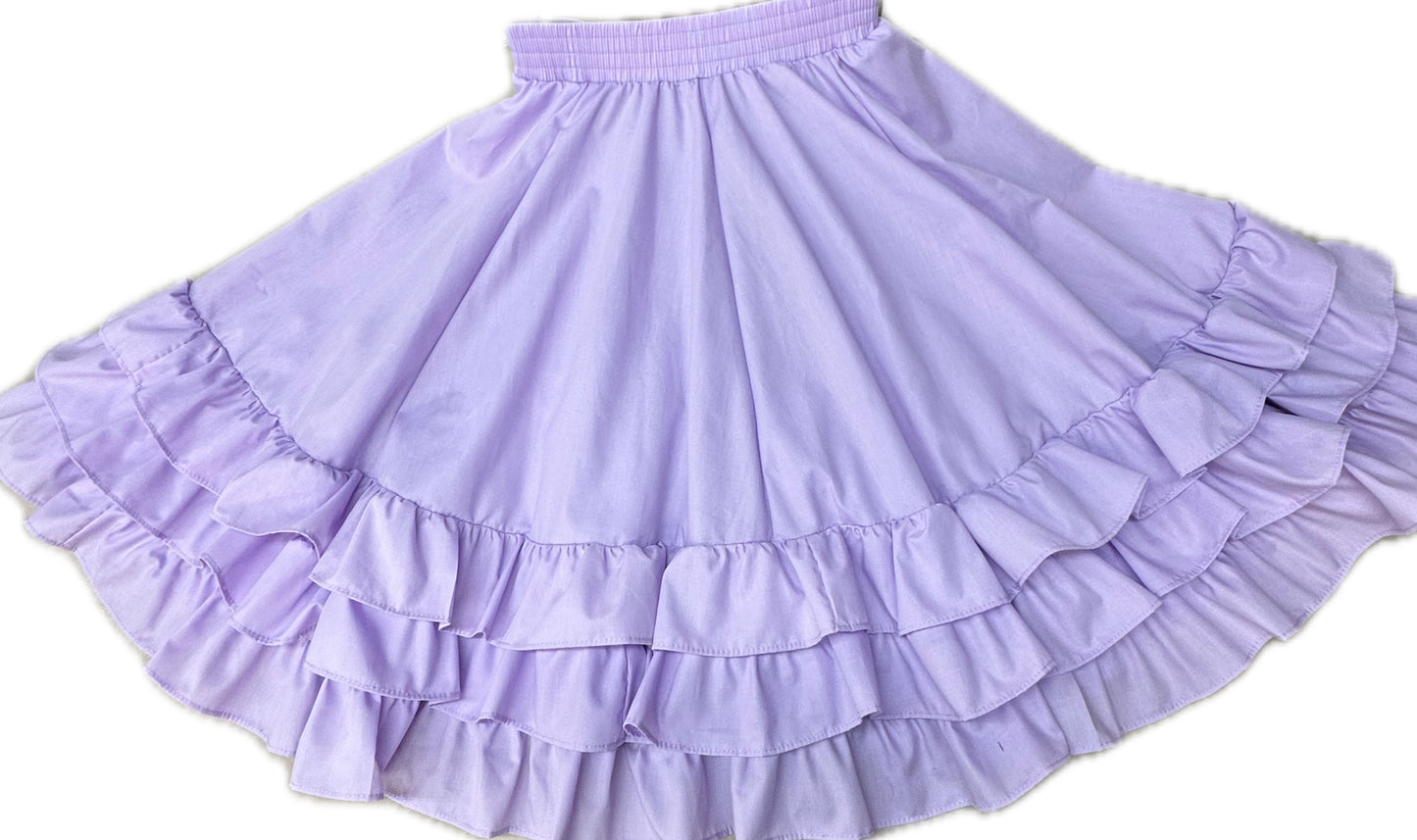 The 3 Ruffle Square Dance Skirt by Square Up Fashions, featuring a lavender hue and an eight-gore, tiered ruffle design, is displayed against a plain white background and available in custom sizes.