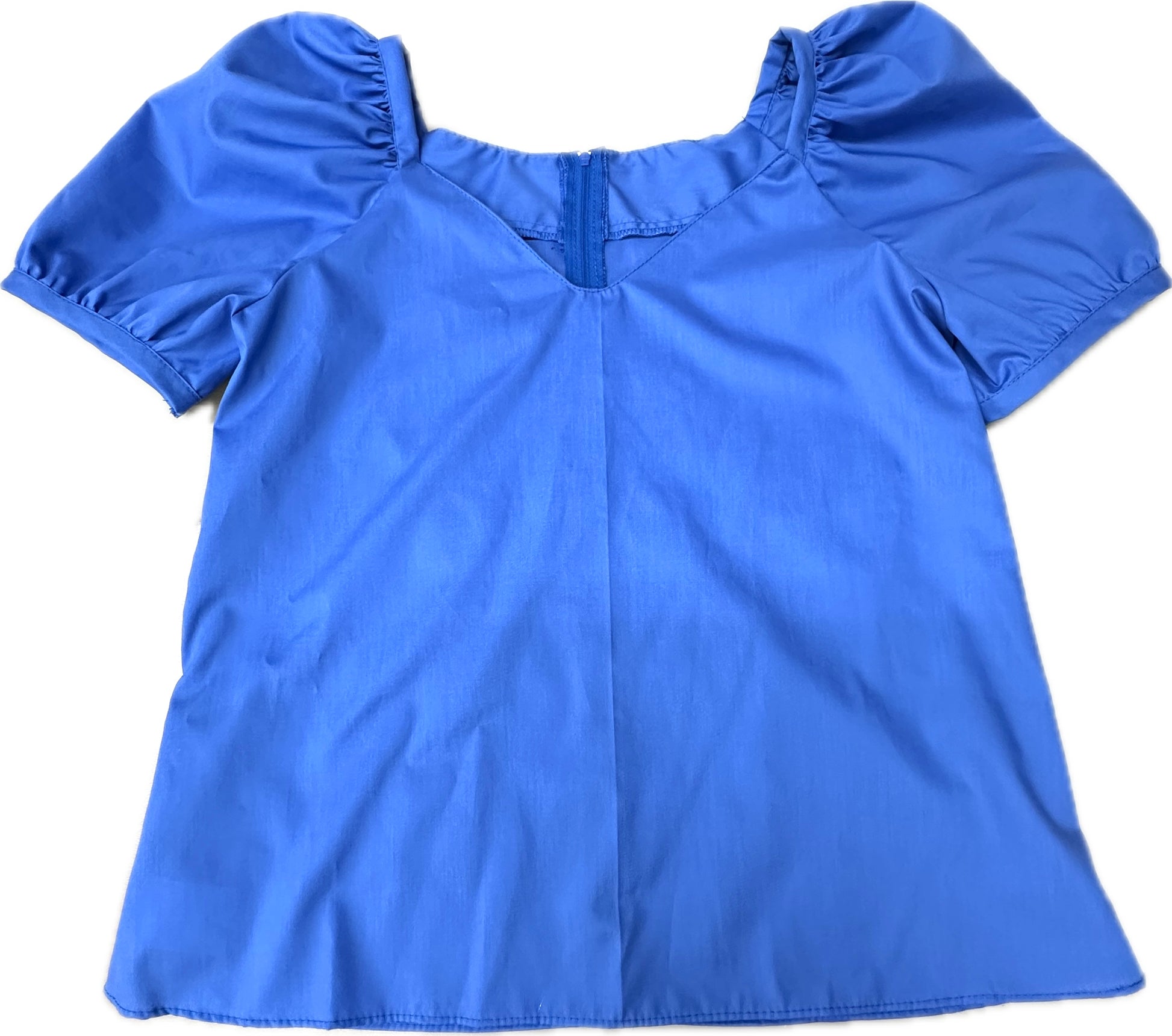 The Sweetheart Neck Blouse by Square Up Fashions features a bright blue color, puffed short sleeves, a zipper back, and a small V-shaped neckline cutout, shown flat on a white background.