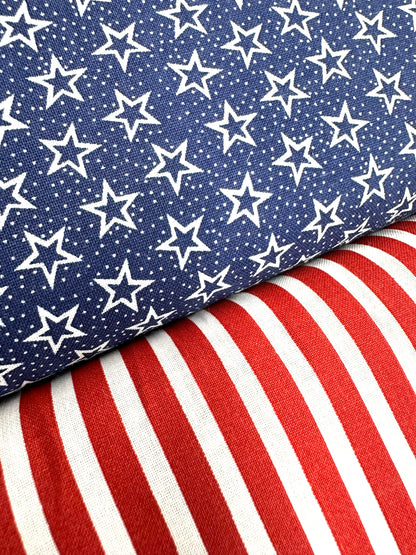 Close-up of two fabrics from the Patriotic Spirit 250th Anniversary Skirt by Square Up Fashions: blue with white stars and red-and-white vertical stripes—perfect for celebrating the Declaration of Independence.