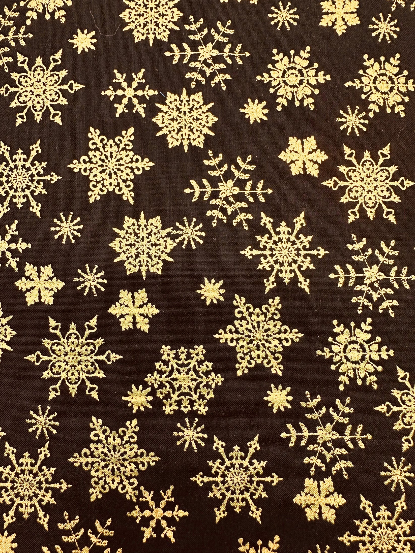 The Golden Snowflake Outfit by Square Up Fashions features gold snowflake patterns on a dark brown background—an elegant choice for festive holiday ensembles or chic New Year's Eve looks.