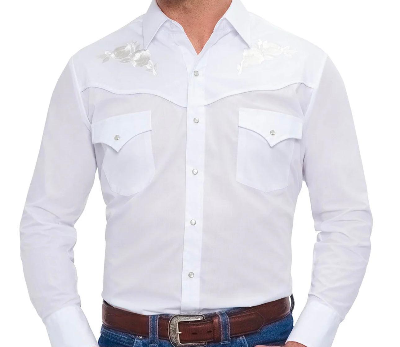 A man wearing the Ely Mens Embroidered Rose Western Shirt by Ely, featuring long sleeves, snap buttons, embroidered roses on the shoulders, and two chest pockets, paired with blue jeans and a brown belt.