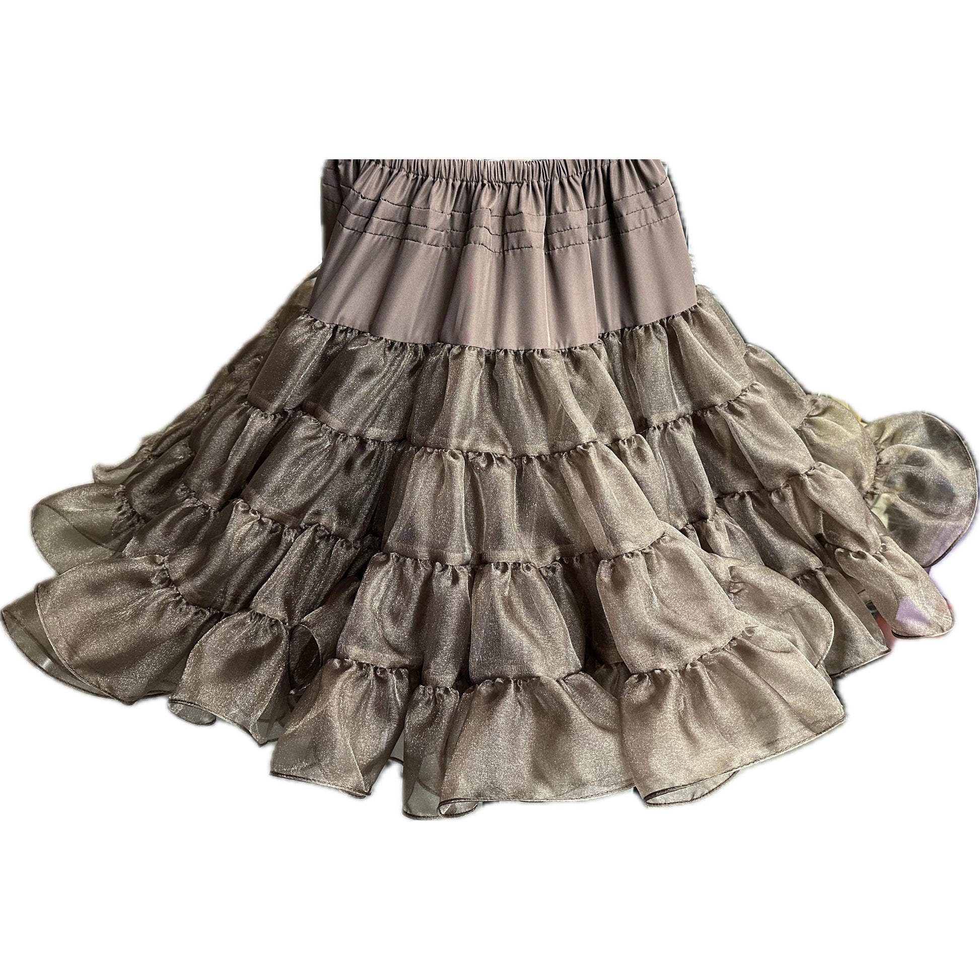 The Crystal Petticoat from Square Up Fashions is a multi-tiered ruffled skirt featuring an elastic waistband, crafted from sheer metallic crystal fabric in a champagne hue.