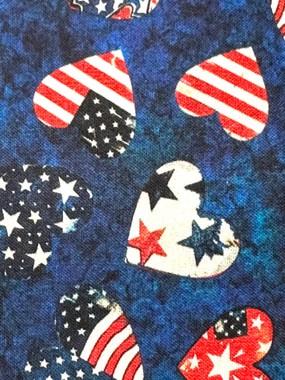 The Square Up Fashions Americana Square Dance Skirt features heart-shaped American flag designs on mottled blue fabric—ideal for square dancing or celebrating the 4th of July in patriotic style.
