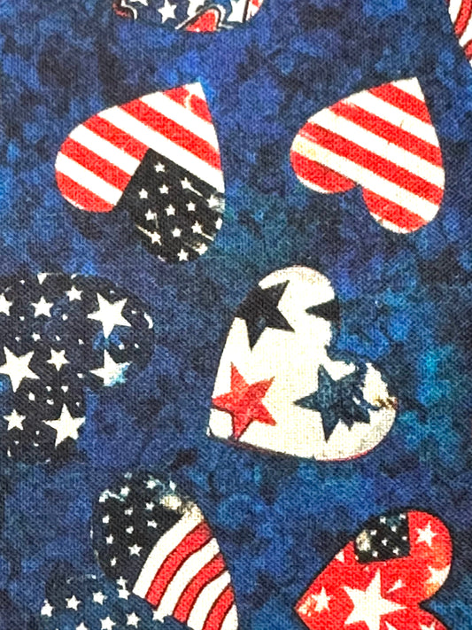 The Square Up Fashions Americana Square Dance Skirt features heart-shaped American flag designs on mottled blue fabric—ideal for square dancing or celebrating the 4th of July in patriotic style.