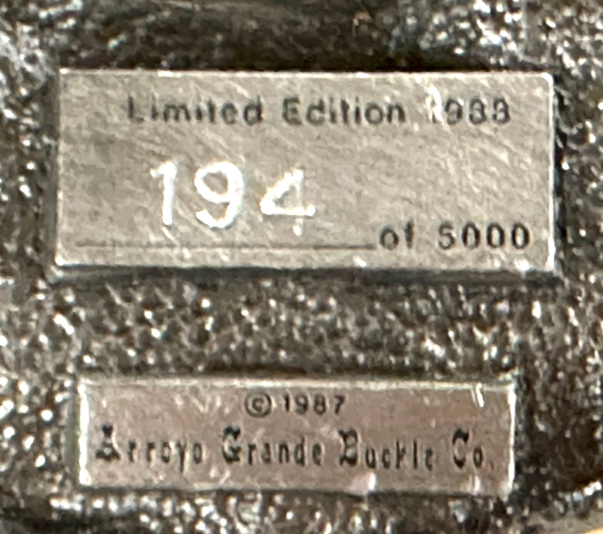 The Square Up Fashions Square Dance Buckle w/ instruments features two engraved metal plaques: one reads "Limited Edition 1983, 194 of 5000" and the other "©1987 Arroyo Grande Buckle Co., Anaheim California.