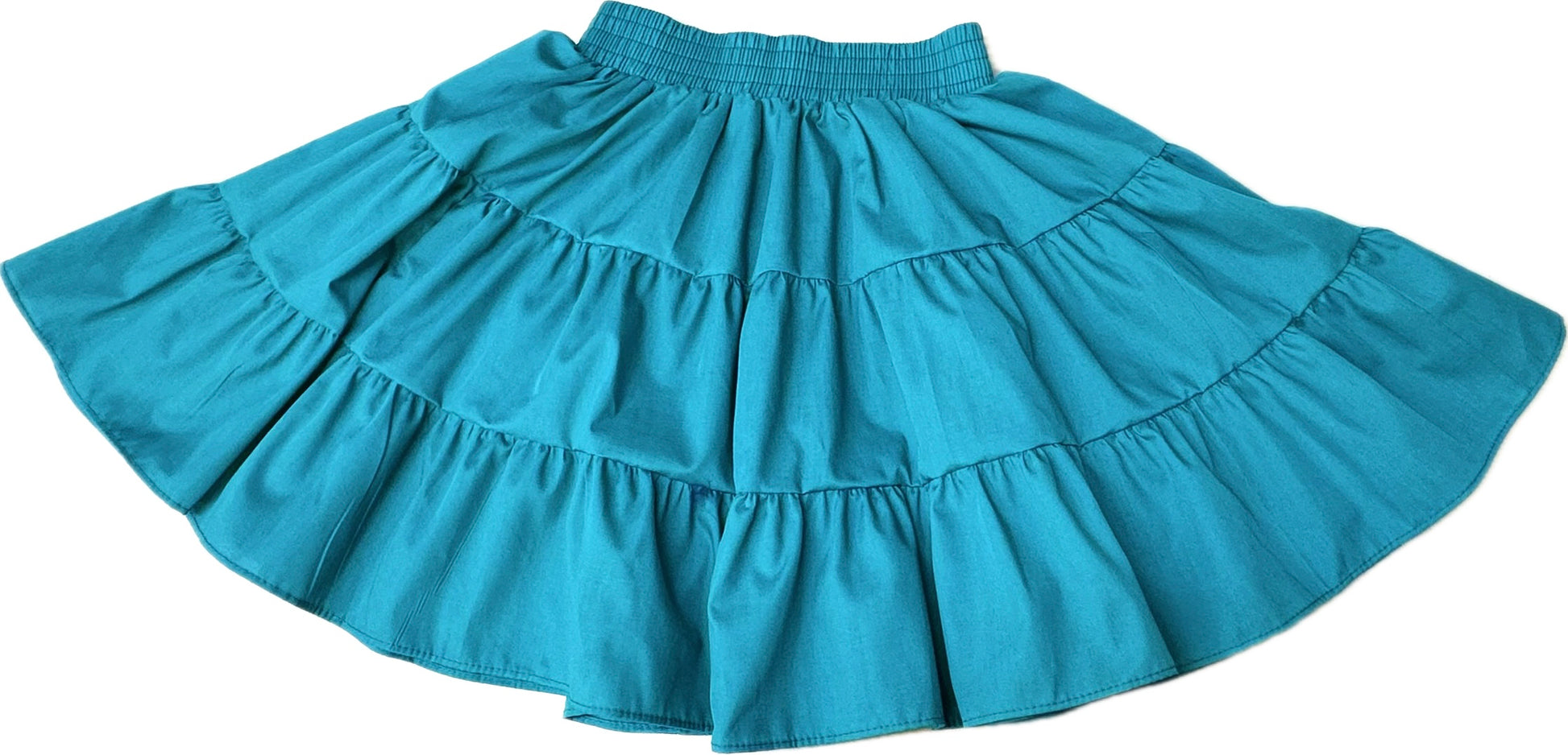 The Square Up Fashions Basic 3 Tier Square Dance Skirt in teal features an elastic waistband and knee-length design, displayed flat—an ideal addition to any wardrobe.