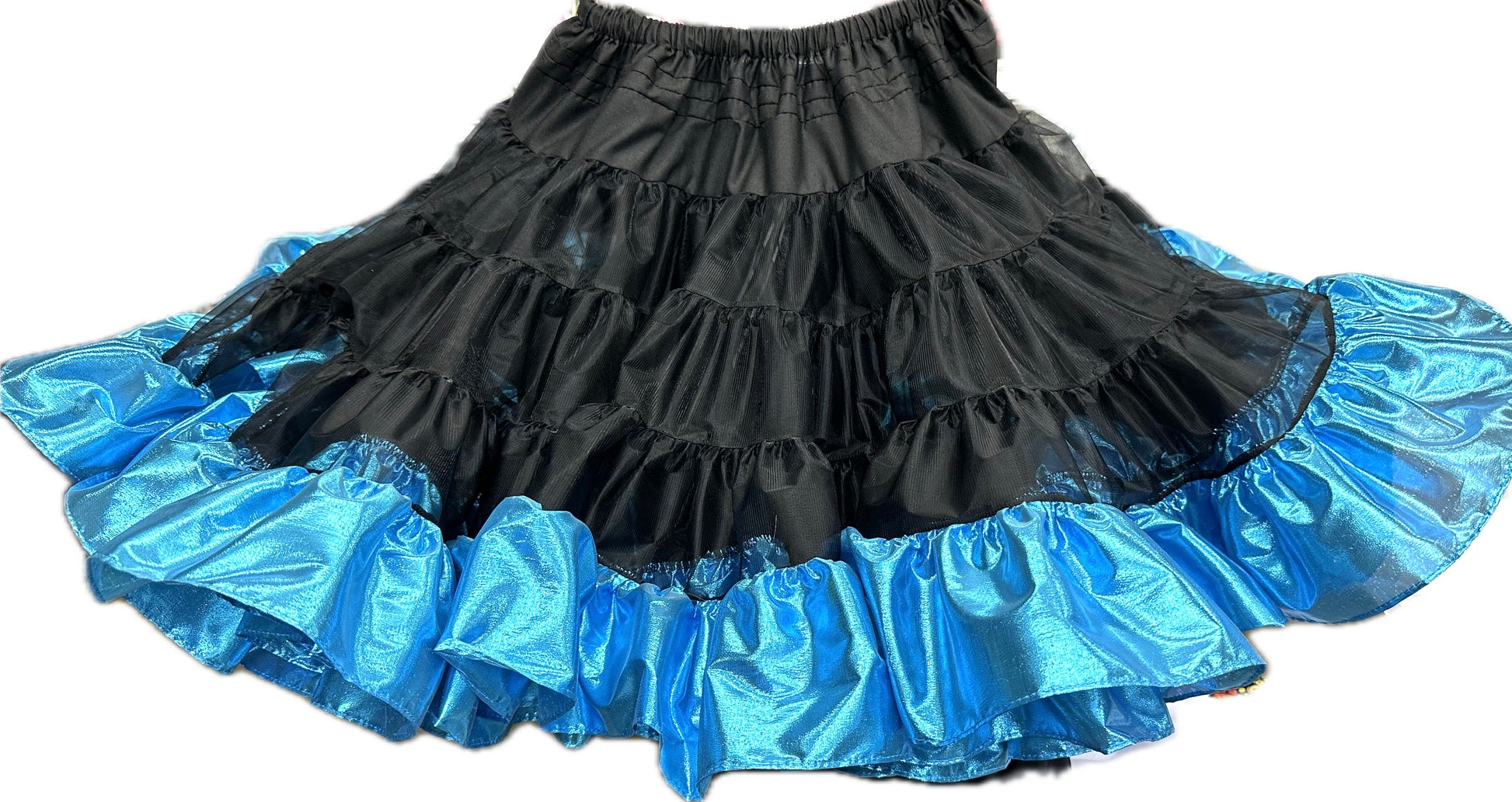 The Combo Metallic Petticoat (60 yard) by Square Up Fashions features black tiers and shiny blue metallic ruffles, perfect for square dance outfits, shown against a white background.
