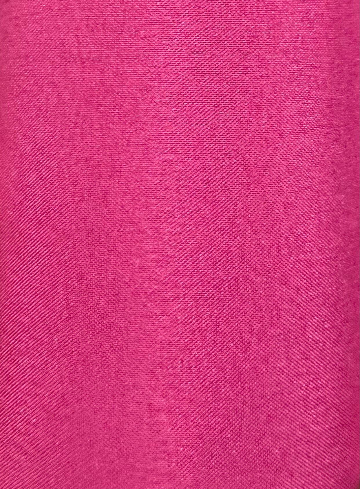 Close-up of the DISCOUNTED Softer Poly-Liner Petticoat fabric by Square Up Fashions, shown in bright pink with a fine diagonal weave—available in 3 colors and perfect as an adjustable slip length for square dancing.