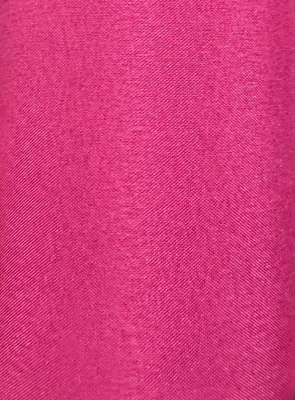 Close-up of the DISCOUNTED Softer Poly-Liner Petticoat fabric by Square Up Fashions, shown in bright pink with a fine diagonal weave—available in 3 colors and perfect as an adjustable slip length for square dancing.