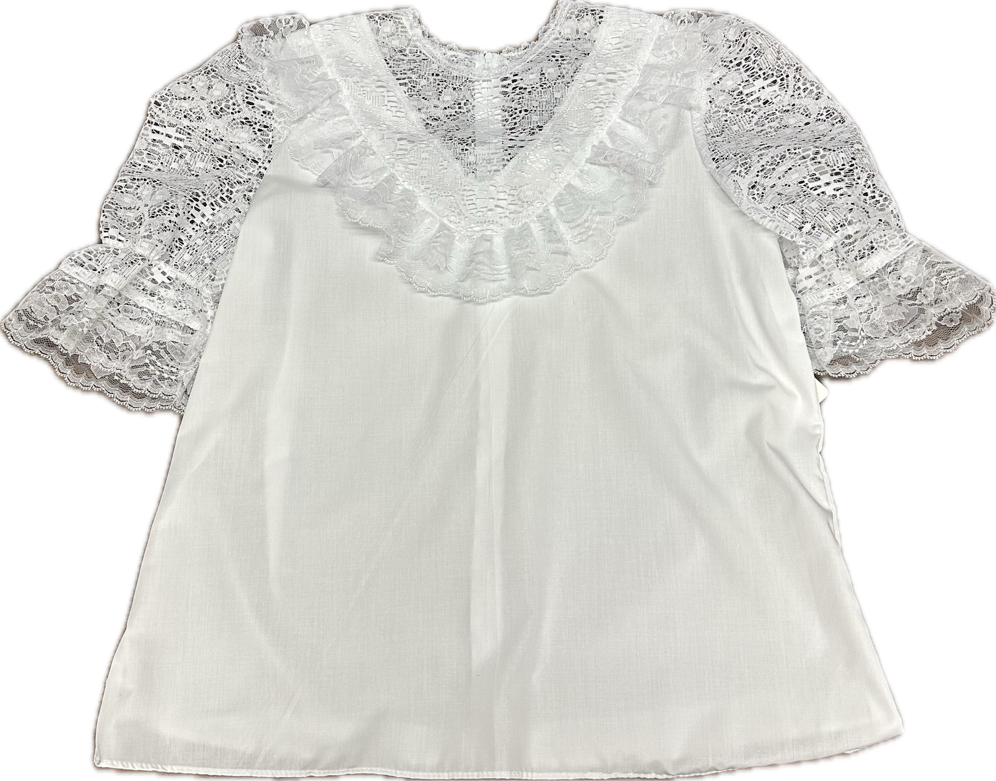 The Elegant Laced Blouse by Square Up Fashions features lace sleeves, ruffled lace trim on the V-neckline, and a loose poly-cotton fit in white.