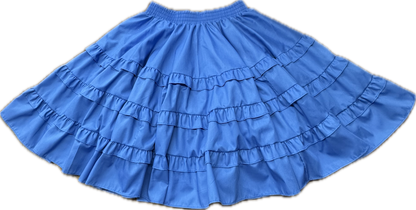 The Double Ruffle Square Dance Skirt by Square Up Fashions is a blue, knee-length skirt with double ruffles and an elastic waistband, shown on a plain background and available in custom sizes.