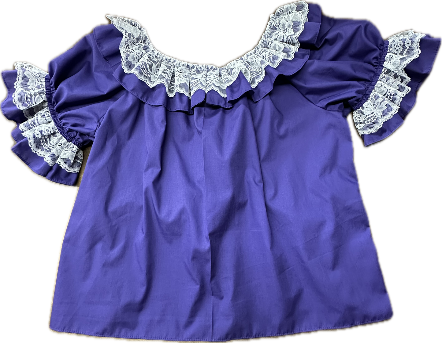 The Laced Scoop Blouse by Square Up Fashions features a purple hue, short ruffled sleeves, a wide neckline, and white lace trim for a charming twist on the classic lace ruffle blouse.
