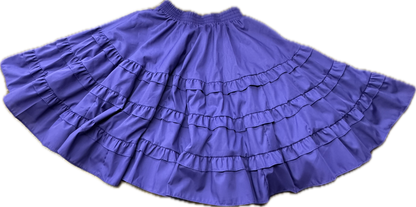 The Double Ruffle Square Dance Skirt by Square Up Fashions, featuring double ruffles and an elastic waistband in purple, is spread out on a light background.
