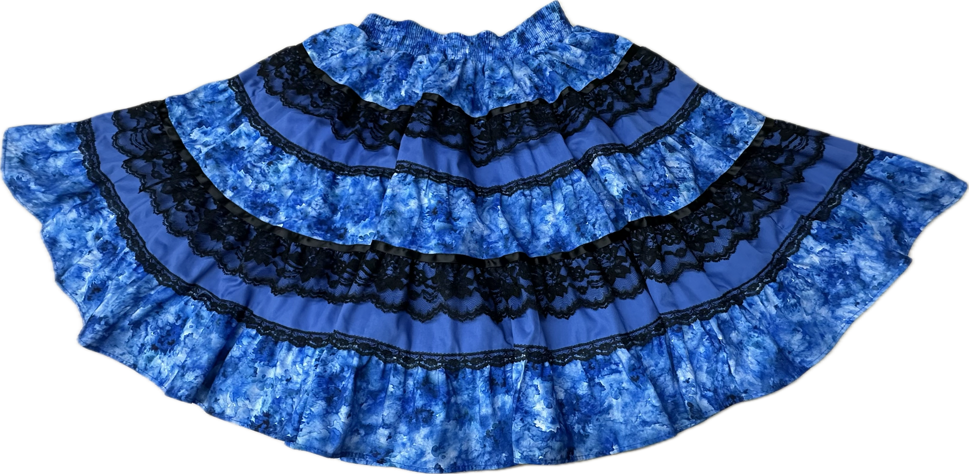 The Tone on Tone Square Dance Skirt by Square Up Fashions features five flared, tiered blue layers with black lace bands—an eye-catching addition to any woman's wardrobe.