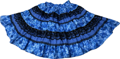The Tone on Tone Square Dance Skirt by Square Up Fashions features five flared, tiered blue layers with black lace bands—an eye-catching addition to any woman's wardrobe.