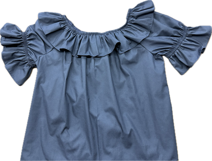 A Scoop Neck Blouse from Square Up Fashions with ruffles on the shoulders.