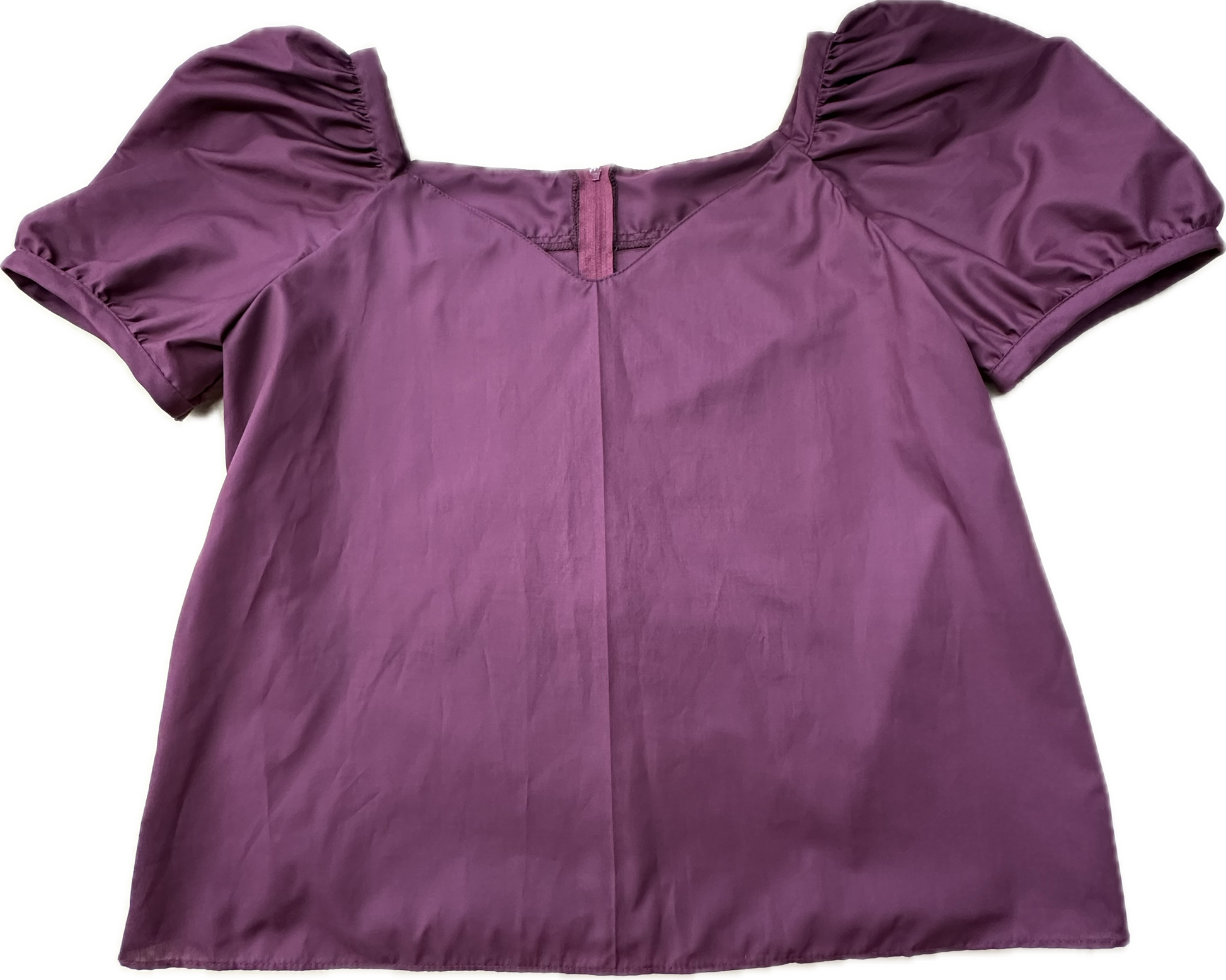 The Square Up Fashions Sweetheart Neck Blouse is a short-sleeved purple top with puffed sleeves, a subtle sweetheart neckline, and a small front V detail, laid flat on a white background for a chic look.