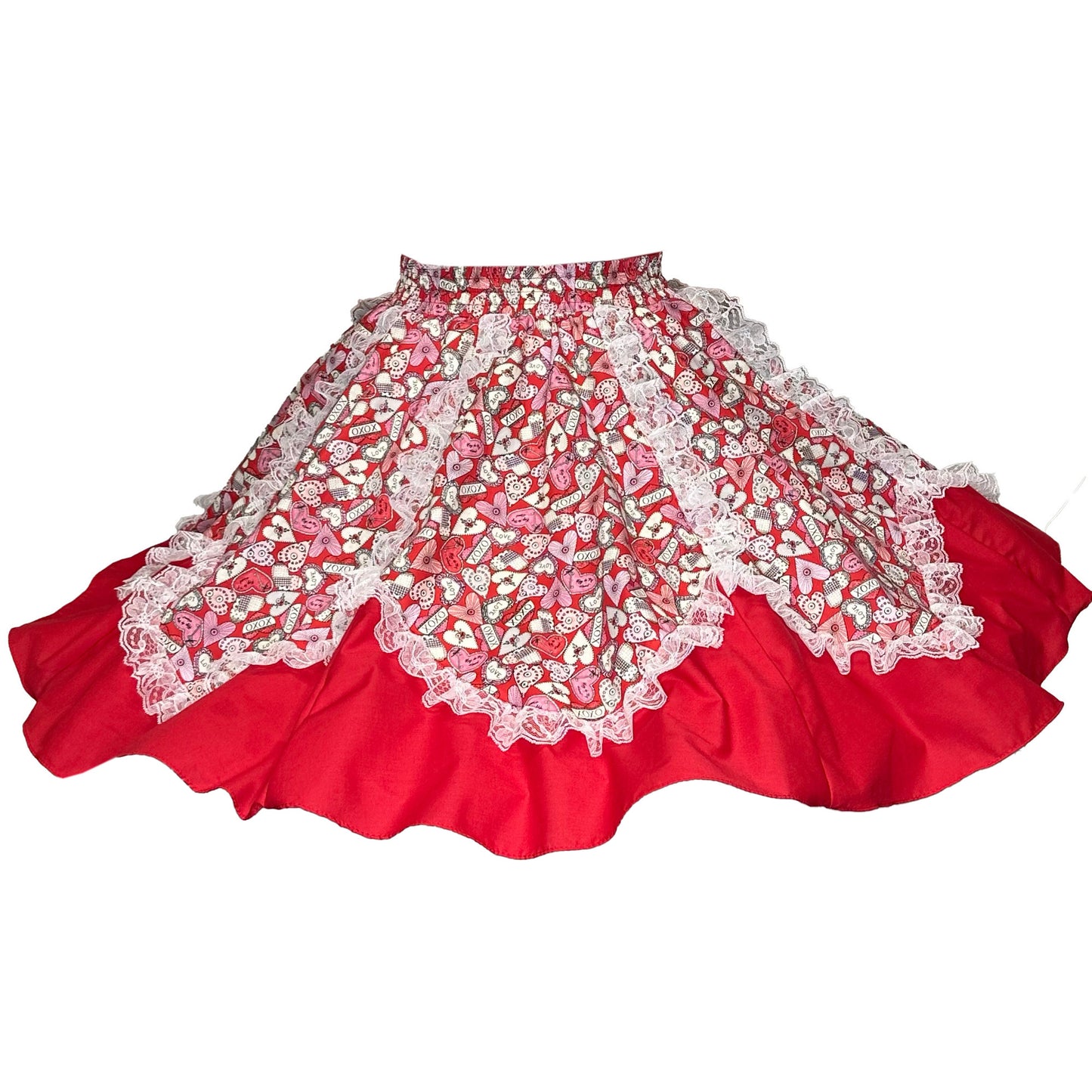 The I Heart You Skirt Square Dance Skirt by Square Up Fashions features a red heart print with a layered, flared silhouette, patterned overlay, and lace trim—perfect for making a romantic statement.